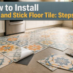 Boxes of peel and stick floor tiles laid flat on a wood grain subfloor.